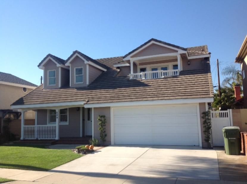 A large house with a white garage door