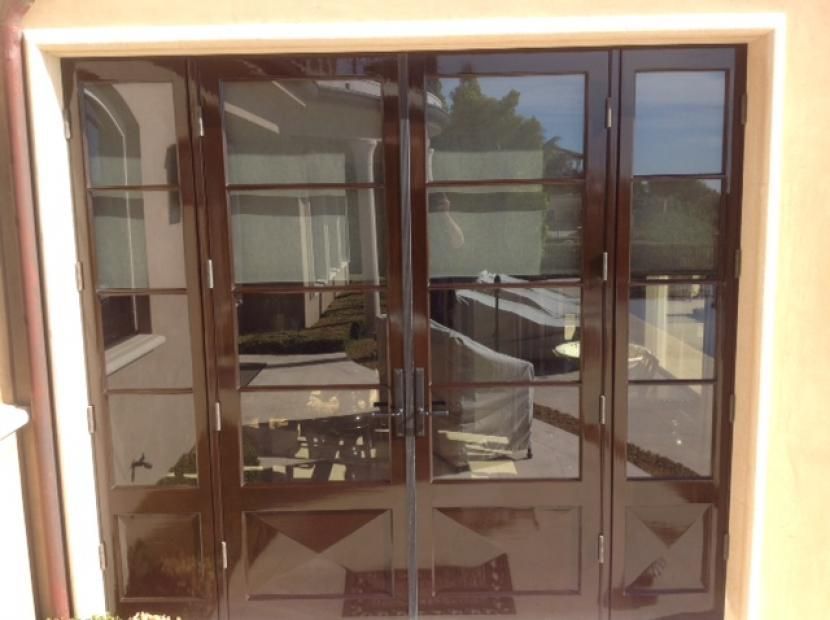 A door that has a lot of glass on it