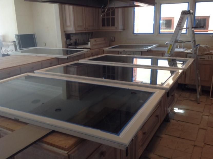 A kitchen with a lot of cabinets and a ladder