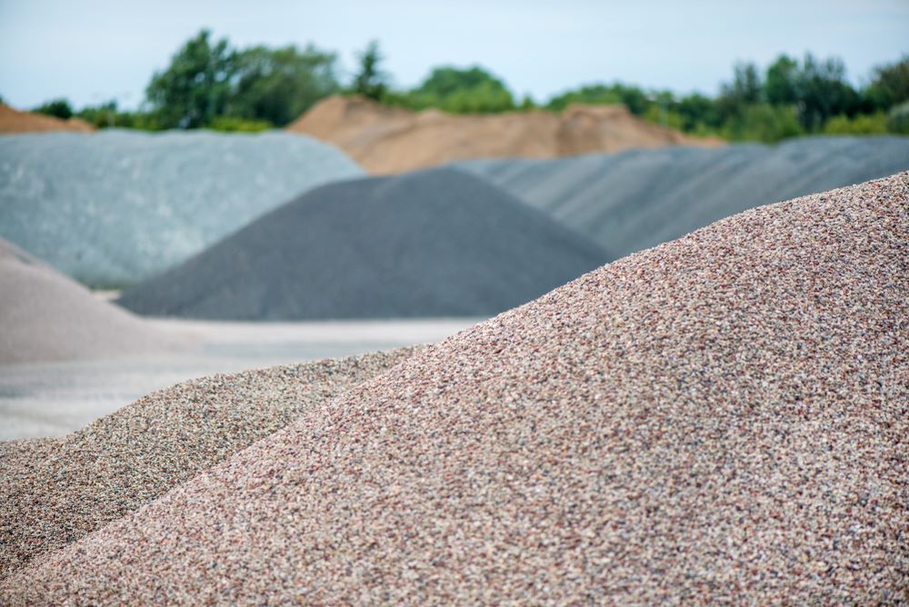 Piles of Gravel in Various Colors: Pink, Gray, and Tan — Cessnock Landscaping Supplies In Cessnock, NSW