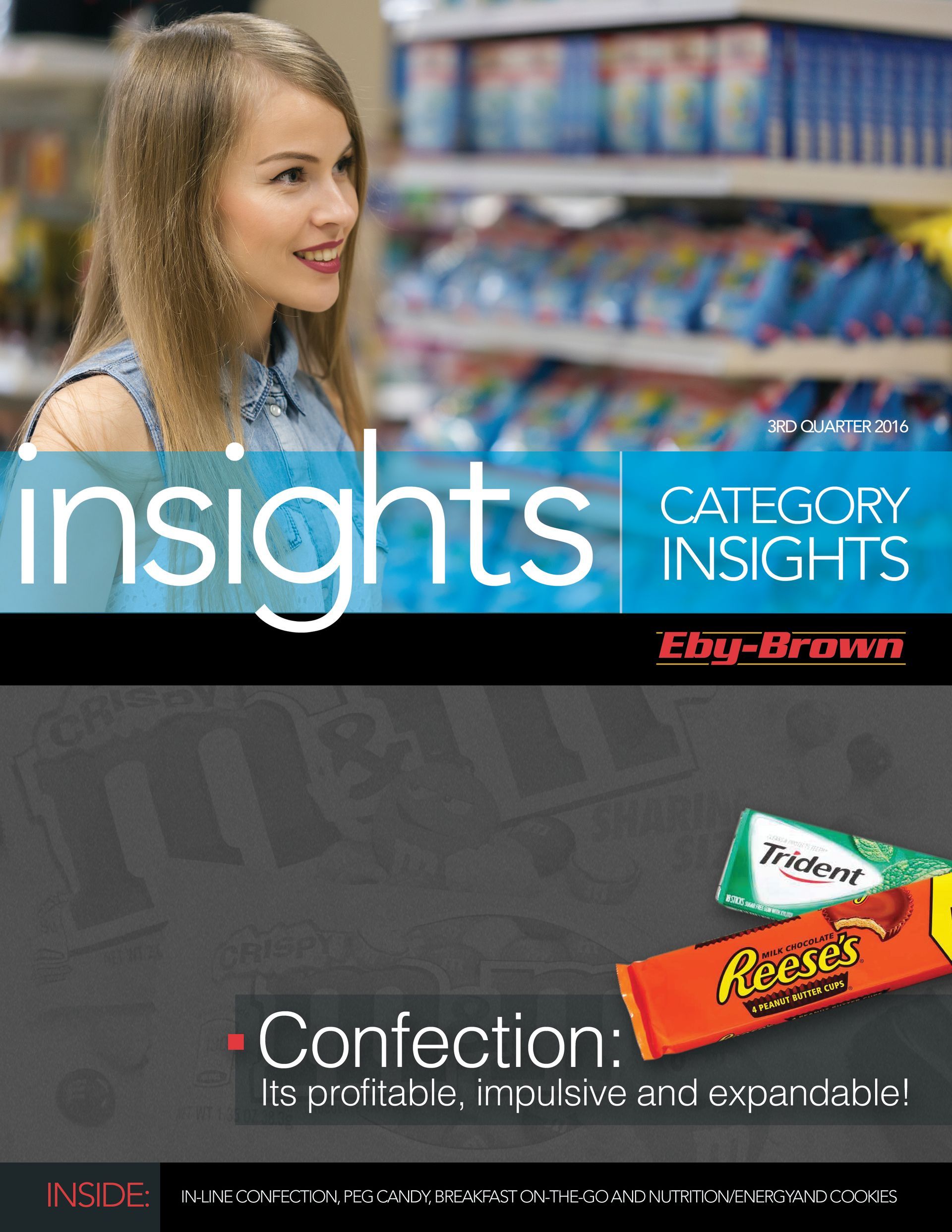 A woman is standing in front of a candy aisle in a store.