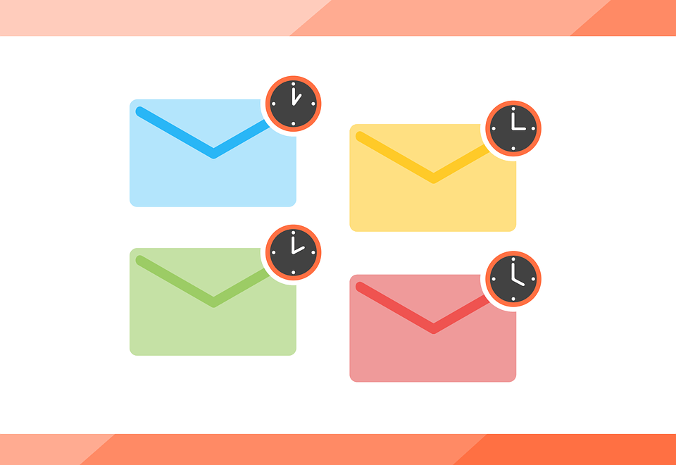 Four colorful envelopes with clocks on them on a white background.