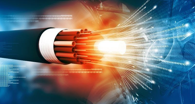 A close up of a fiber optic cable with a light coming out of it.