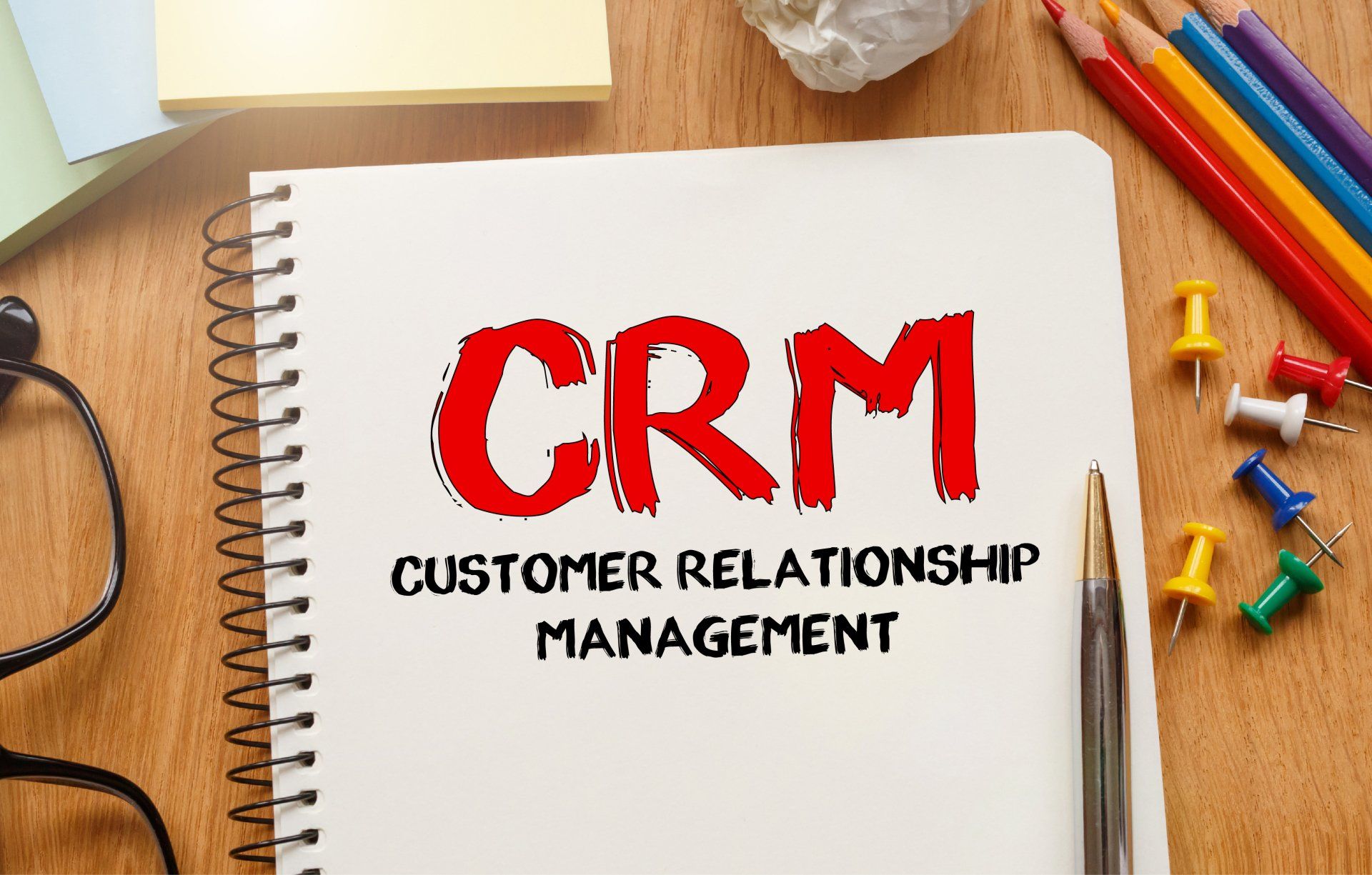 A notebook with the word crm written on it