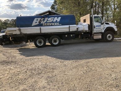 A Bush Services Truck is Parked in a Gravel Lot — Graceville, FL — Bush Services Inc.