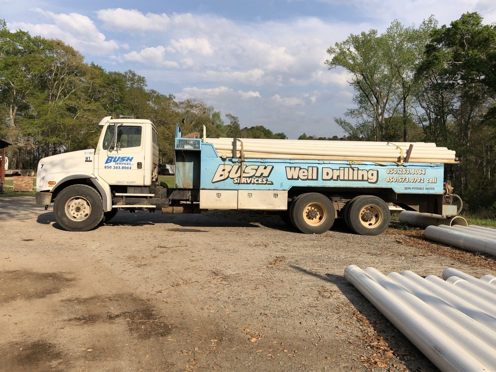 A Well-Drilling Truck is Parked in a Gravel Lot — Graceville, FL — Bush Services Inc.