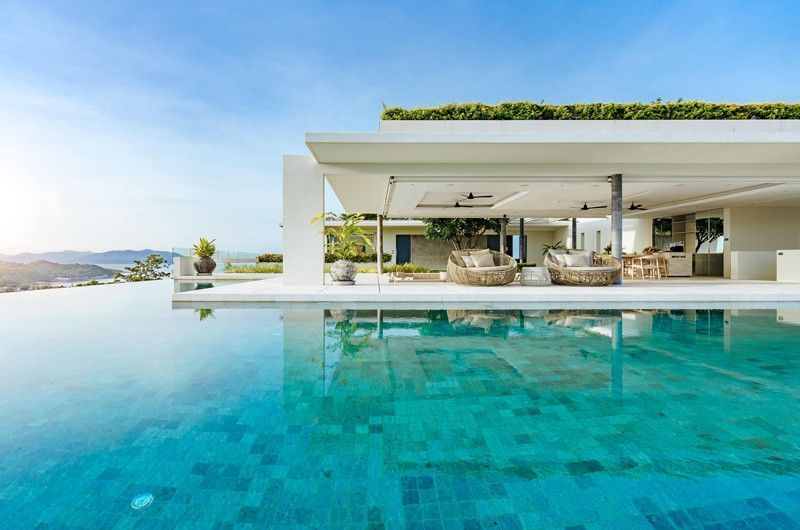 A large villa with a swimming pool in front of it in Koh Samui, Thailand.