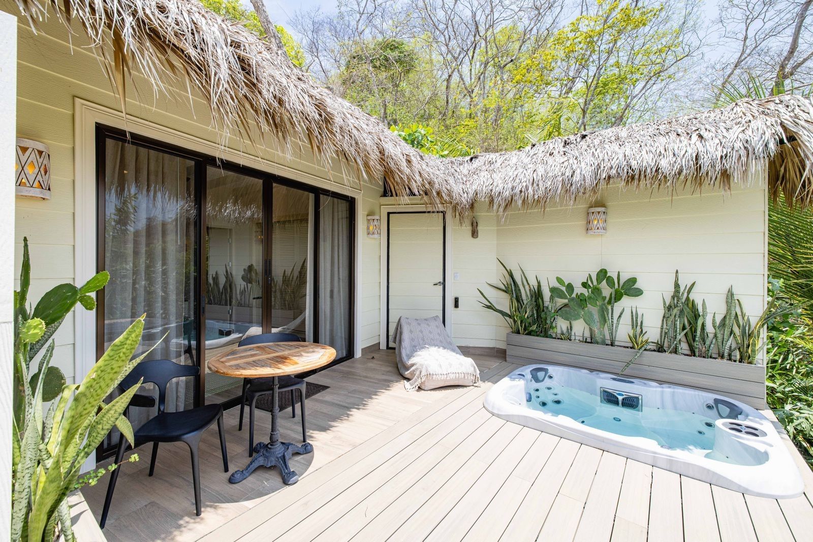 There is a hot tub on the deck of a house at villa in Costa Rica.