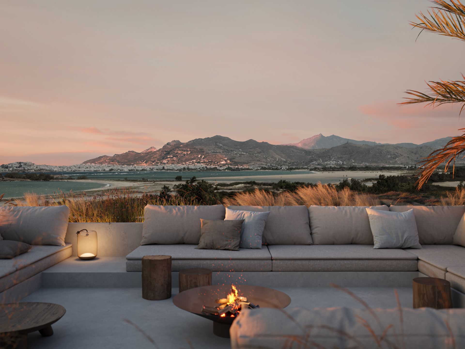 There is a fire pit in the middle of the patio at Laguna Coast Resort in Naxos, Greece.