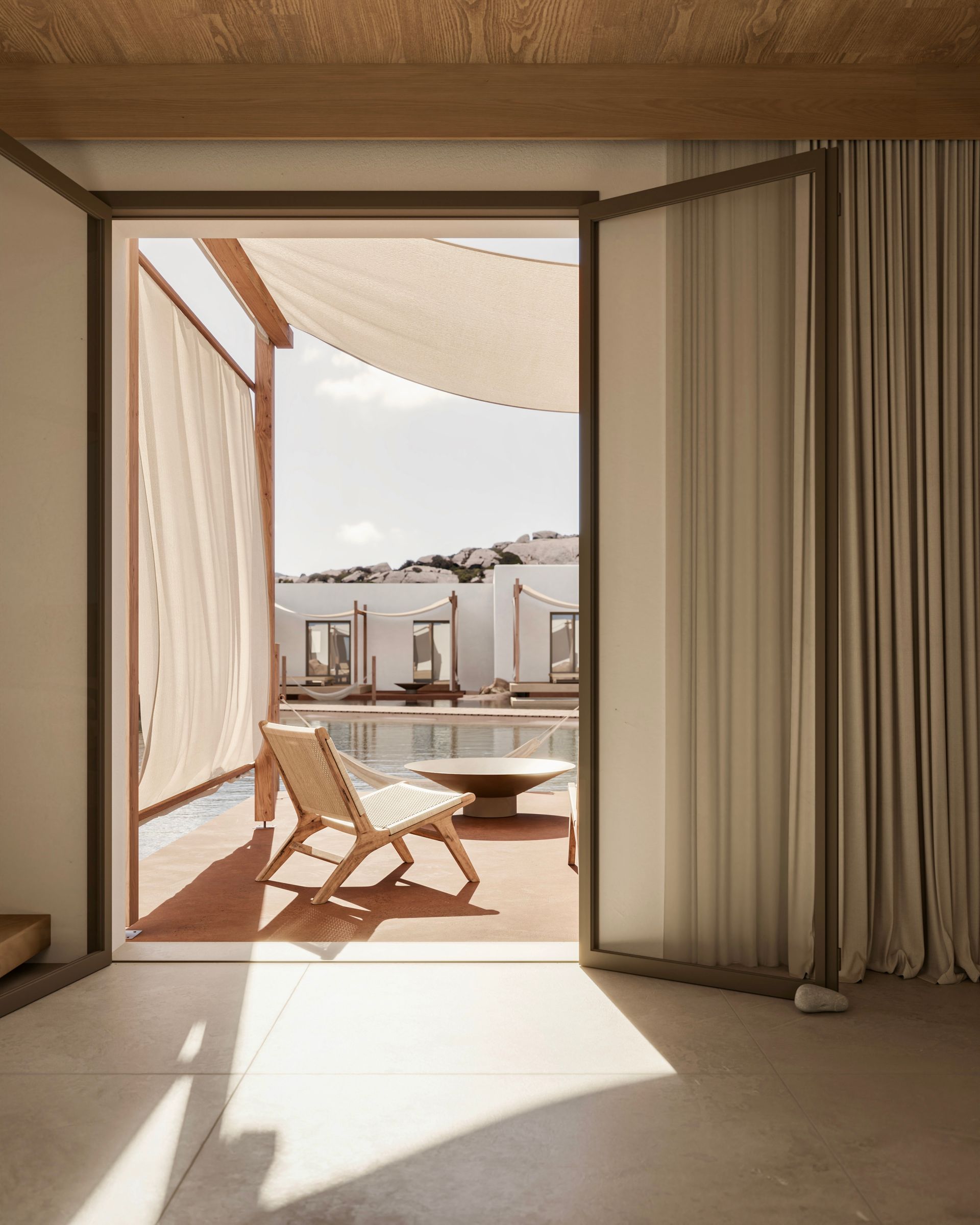 A hotel room with a view of a swimming pool at Laguna Coast Resort in Naxos, Greece.