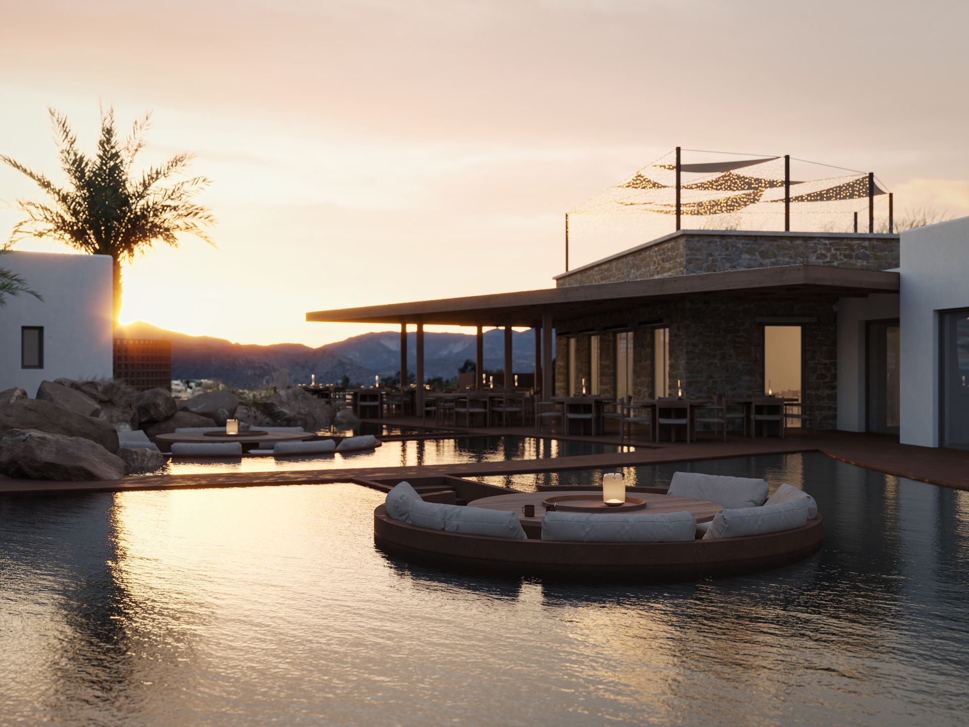 A large swimming pool with Laguna Coast Resort in the background at sunset in Naxos, Greece.