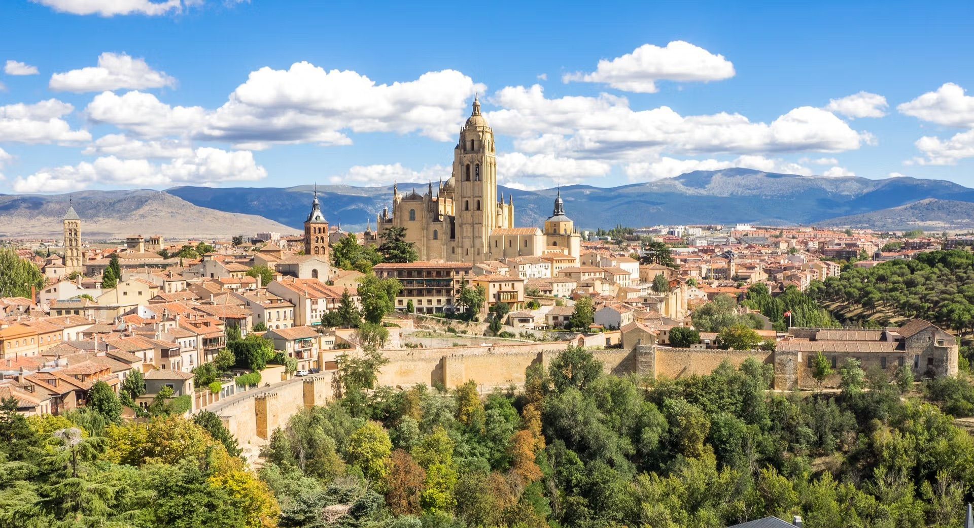 An aerial view of a city with mountains in the background in Spain.