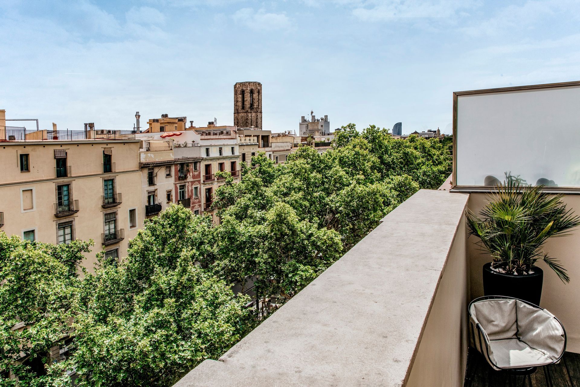 A balcony with a view of Barcelona, Spain at Hotel Bagués.