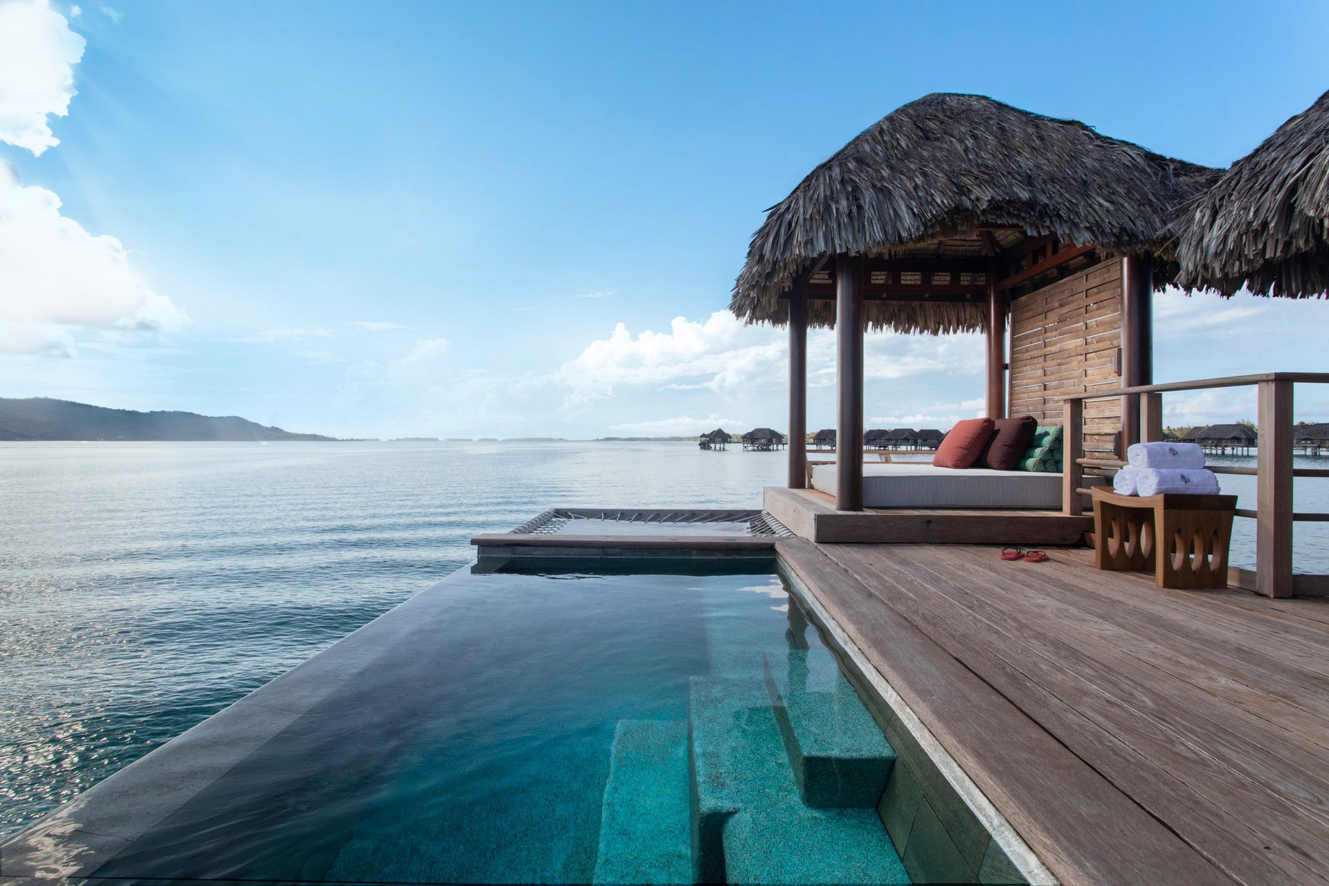 A swimming pool in an overwater bungalow in Bora Bora at Four Seasons Resort. 