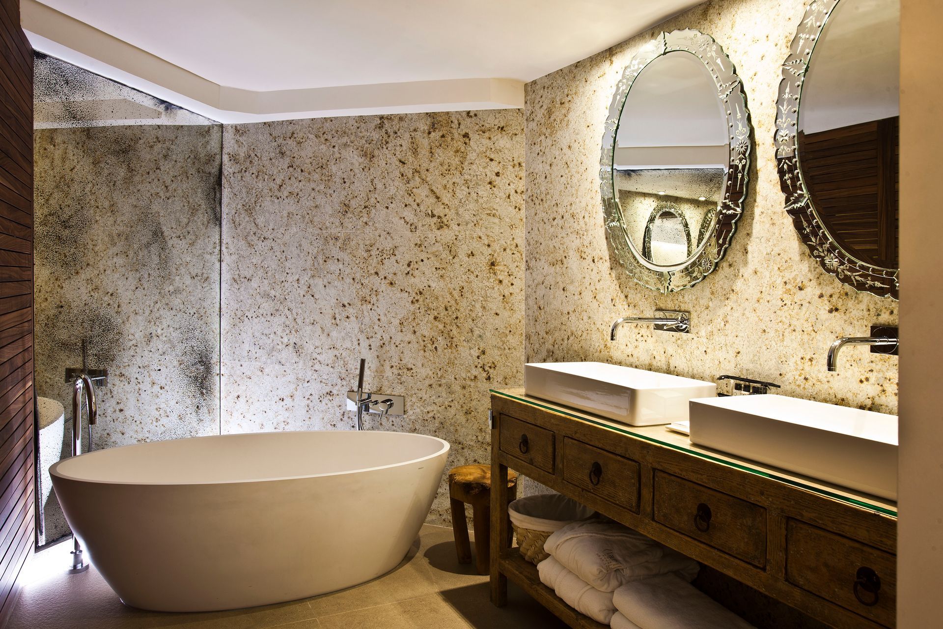 A bathroom with two sinks and a bathtub at Claris Hotel & Spa in Barcelona, Spain.