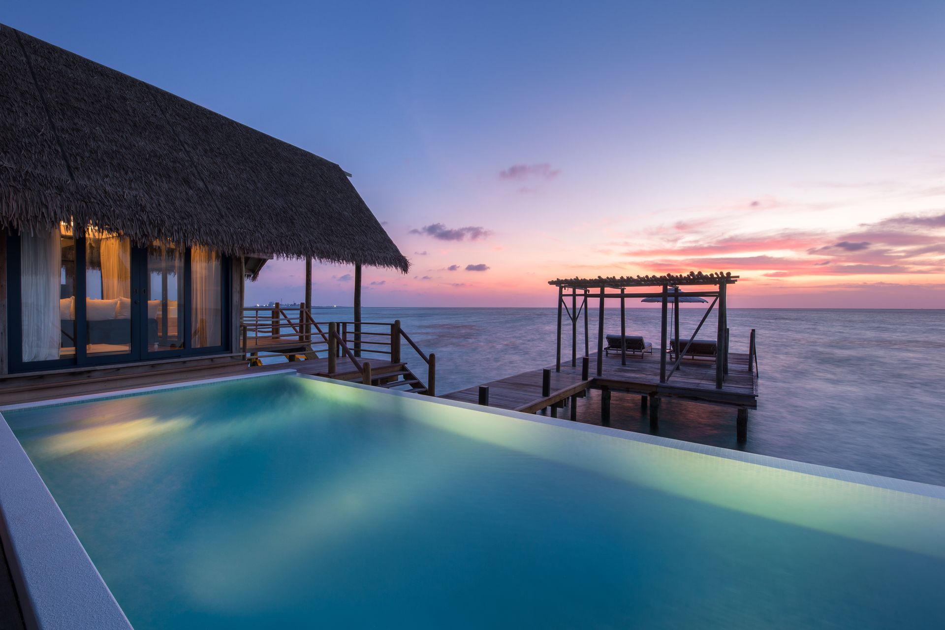 There is a swimming pool in an overwater bungalow at Como Resort in the Maldives. 