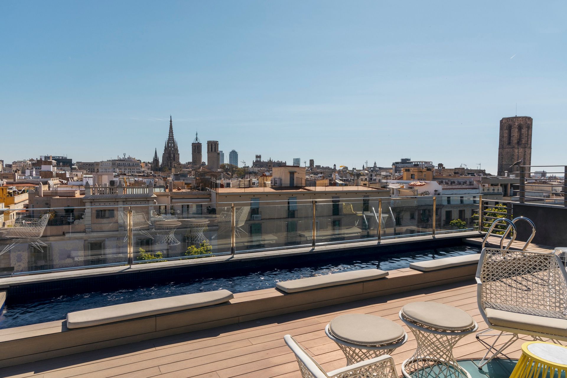 There is a view of view of Barcelona, Spain from the rooftop of Hotel Bagués.