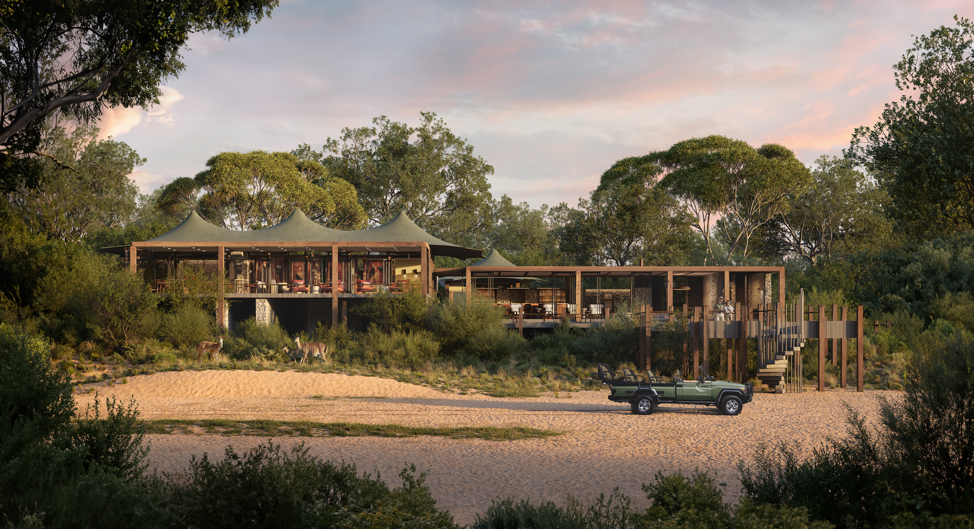 A car is parked in front of a large camp surrounded by trees in Africa.