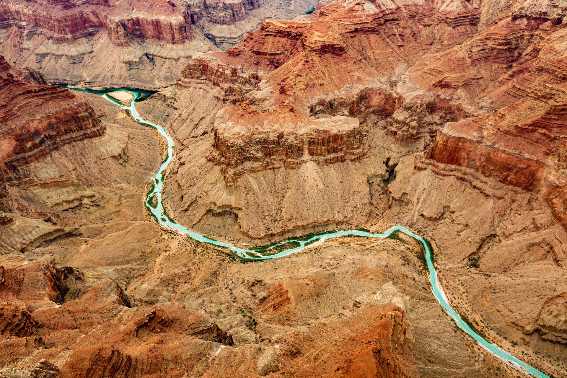 An aerial view of a river running through the Grand Canyon in Arizona.