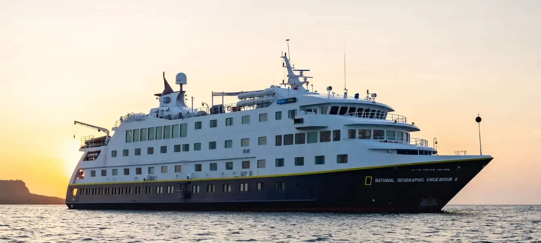 Lindblad's Endeavour II Expedition Cruise ship is floating on top of a body of water.