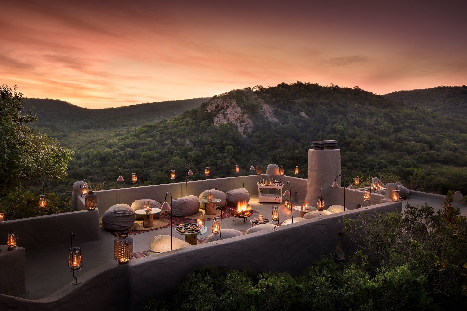 A lodge with a sunset in the background in Africa.