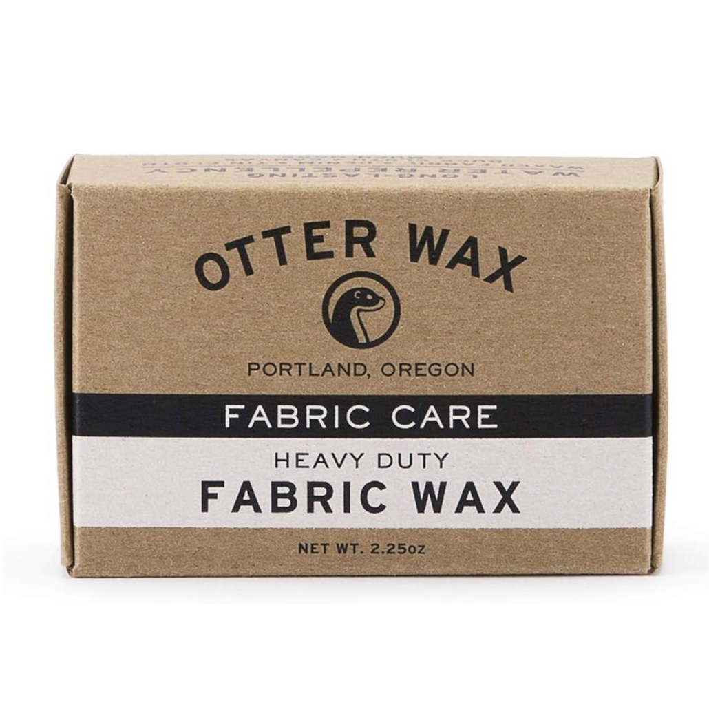 Two black handheld fans are sitting next to each other on a white surface.