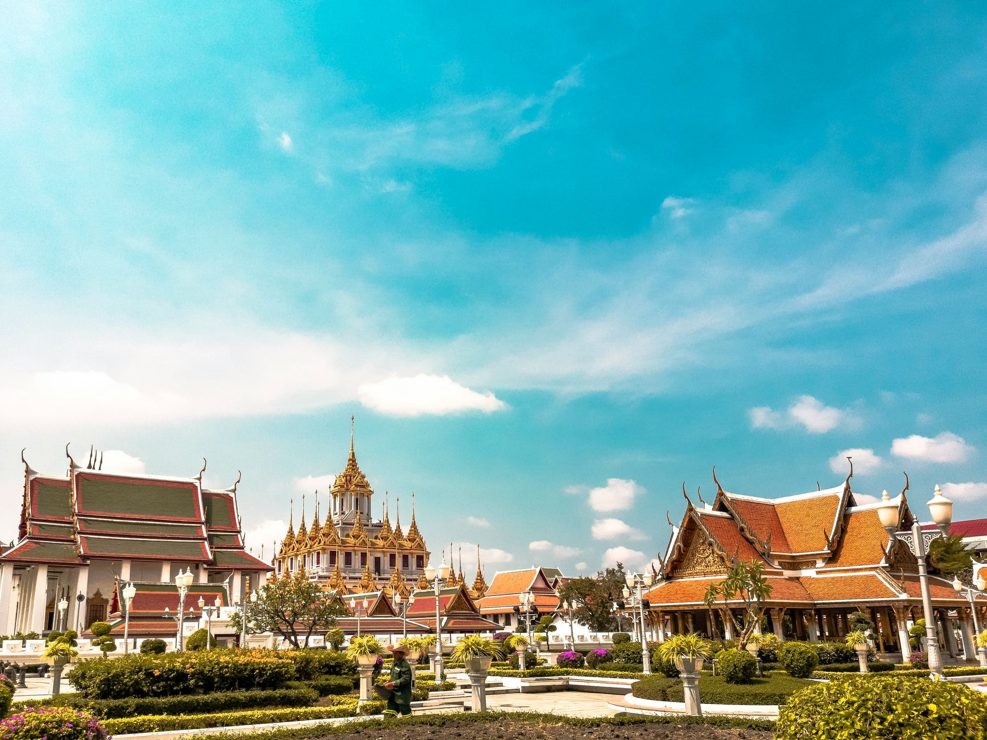 A temple in Bangkok, Thailand, with a blue sky in the background.