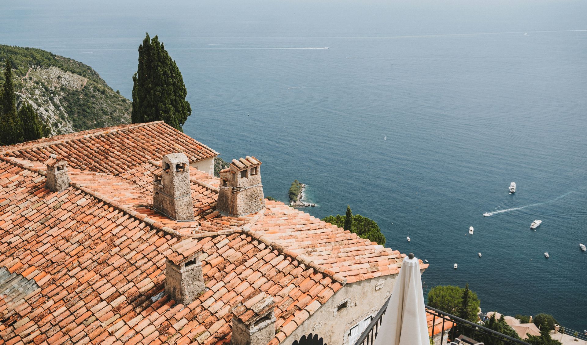 The roof of a building with a view of the ocean on the French Riviera.