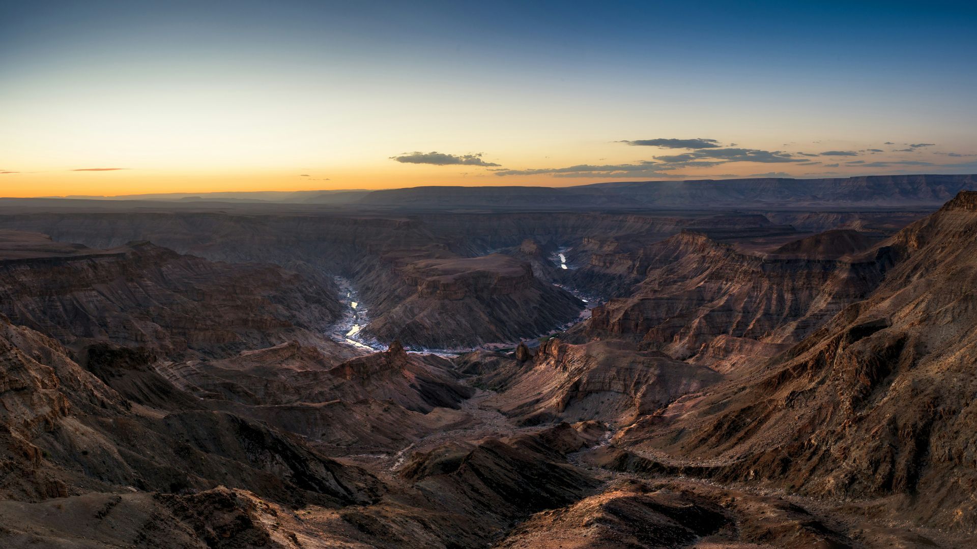Fish River Canyon landscape at sunset; river winding through the rock formations in Namibia.