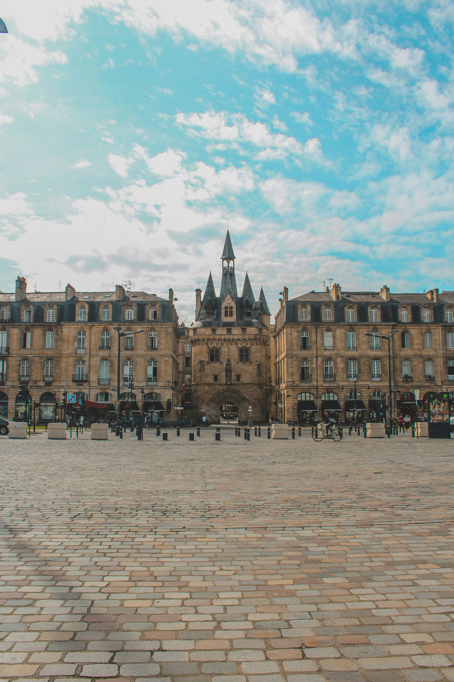 A brick square with the Place de la Bourse in the background in Bordeaux, France.