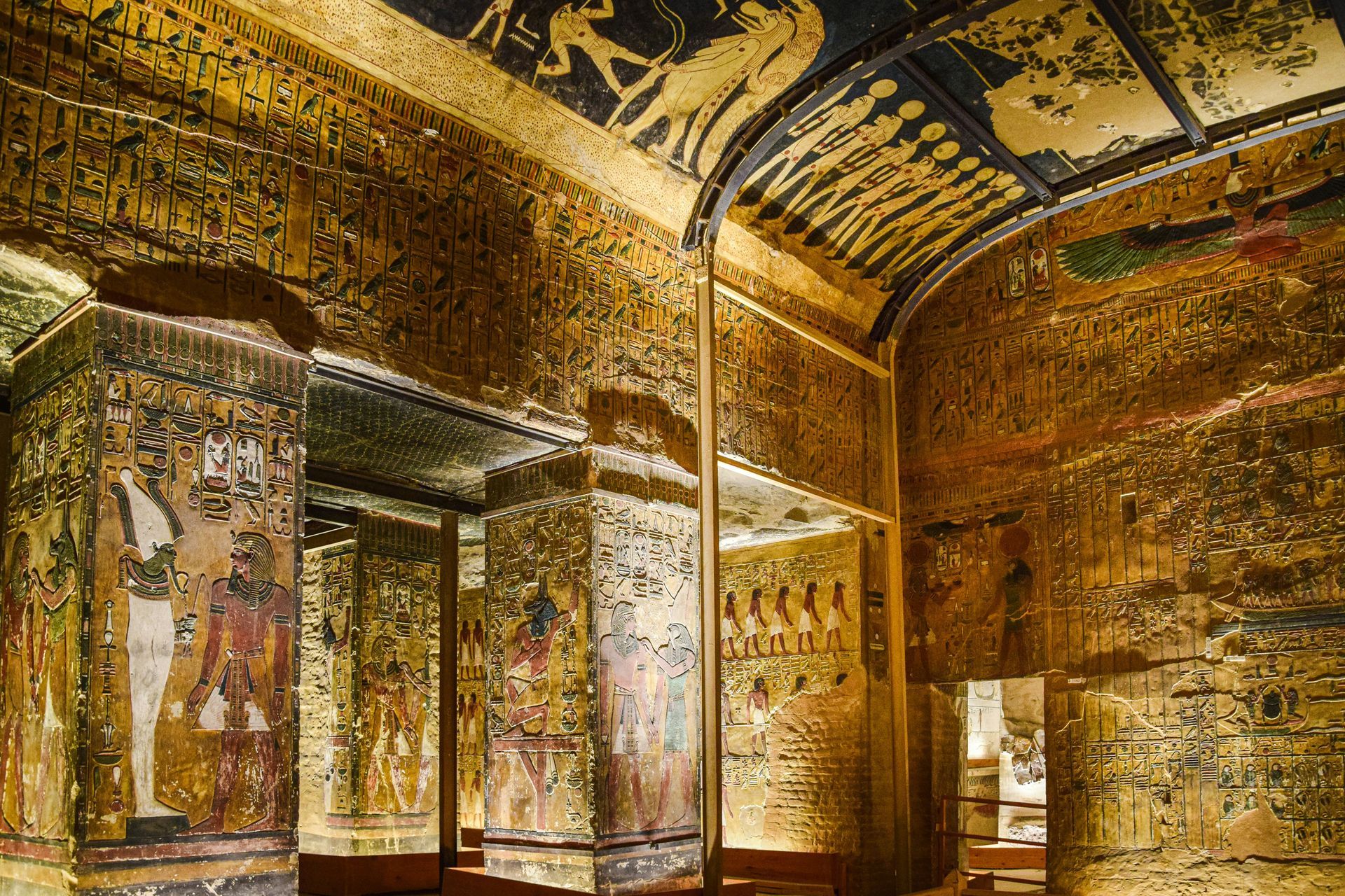A room with a lot of hieroglyphs on the walls and ceiling in Egypt.