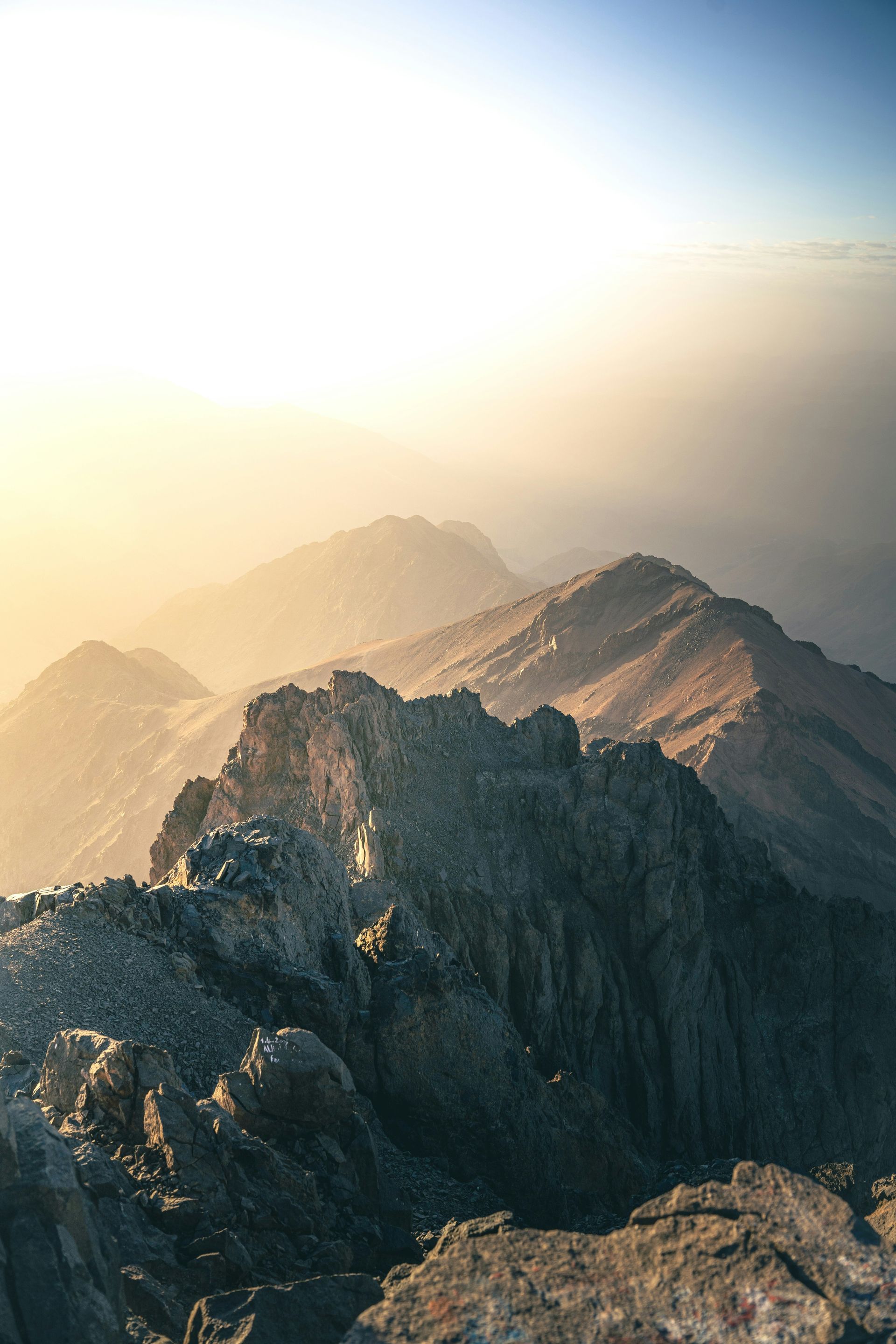 A view of a mountain range from the top of a mountain in Toubkal, Morocco.