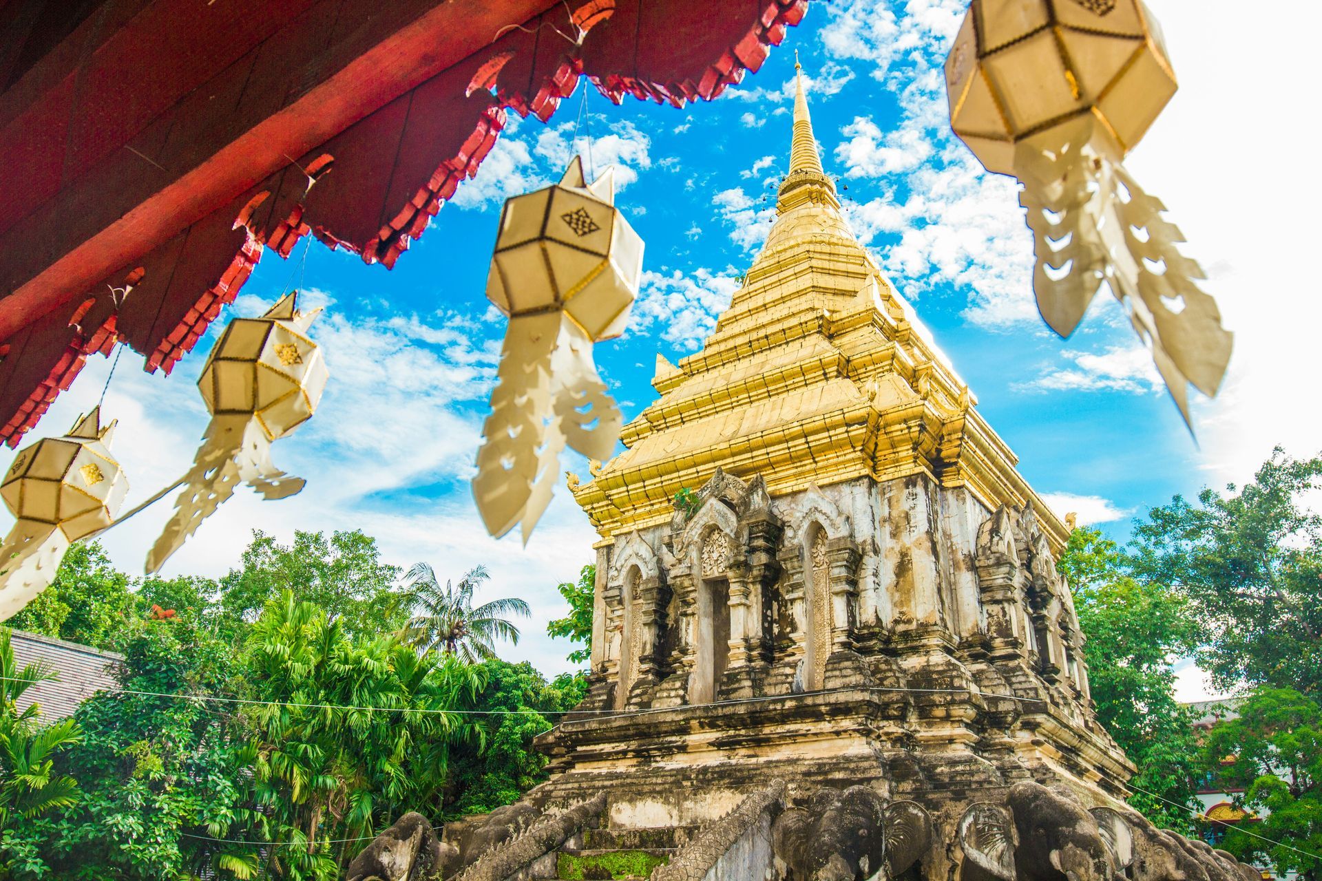 A temple with lanterns hanging from the roof in Chiang Mai, Thailand.