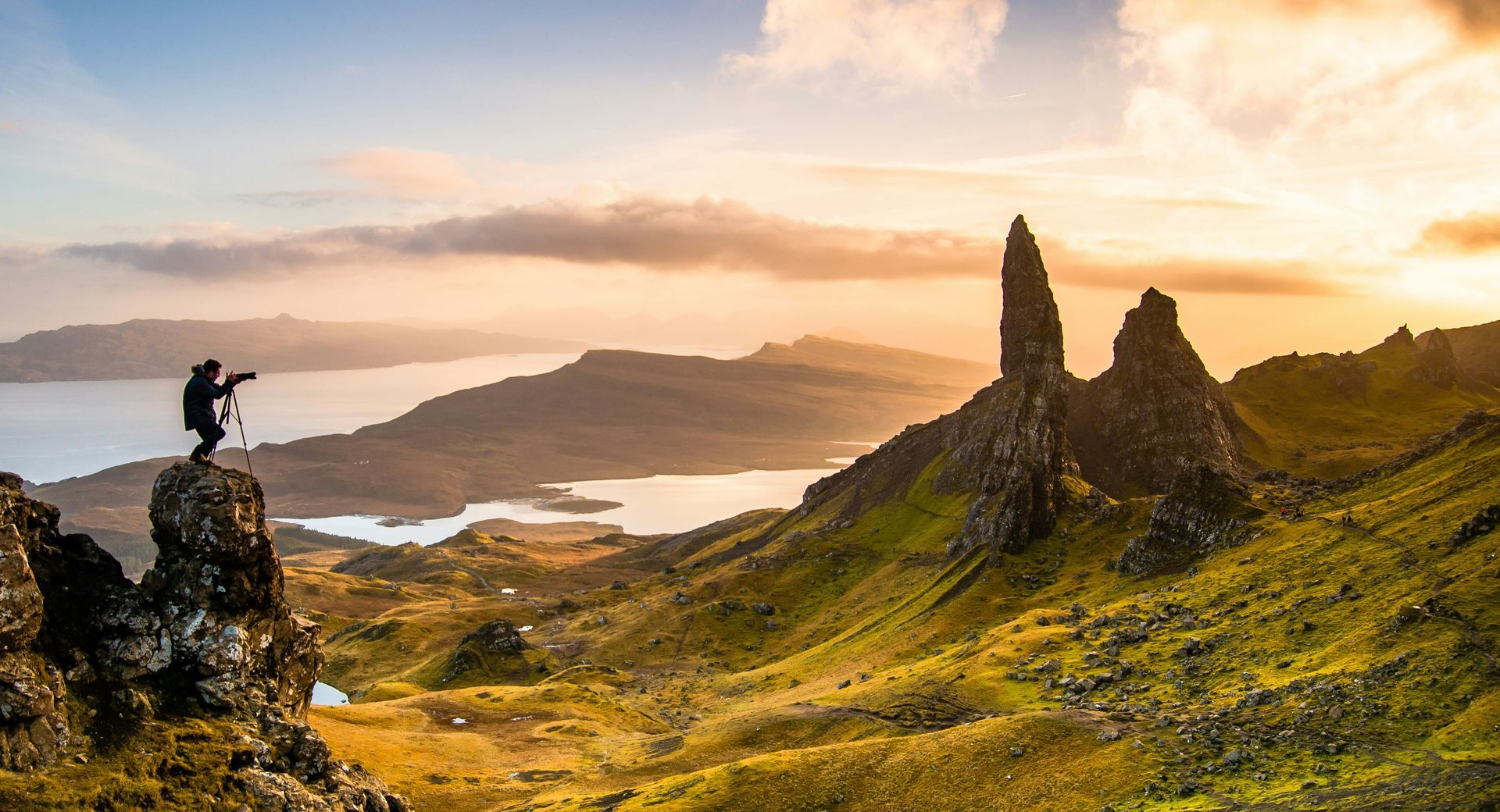 Sunrise over a dramatic landscape of the Storr mountains and water on the Isle of Skye, Scotland.