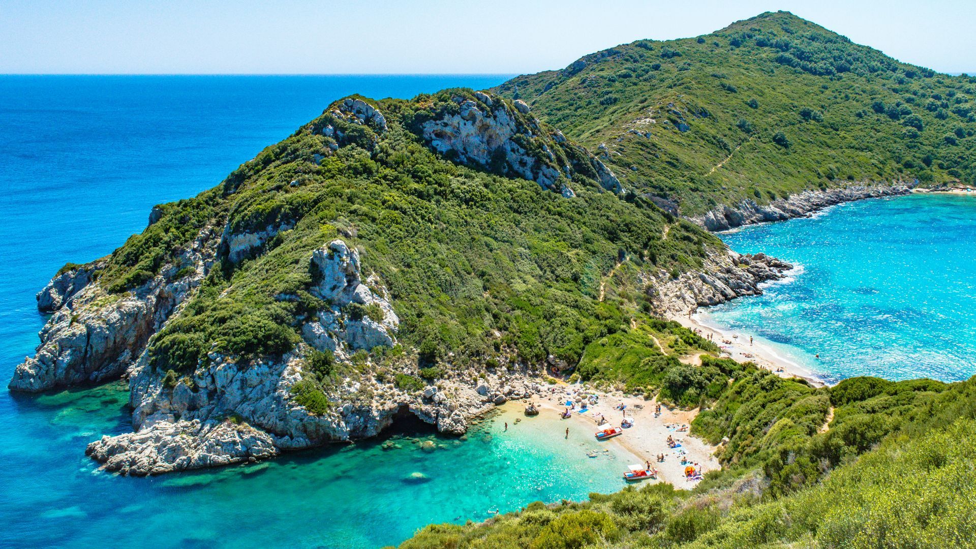 Porto Timoni beach and a mountain in the background in Corfu, Greece.