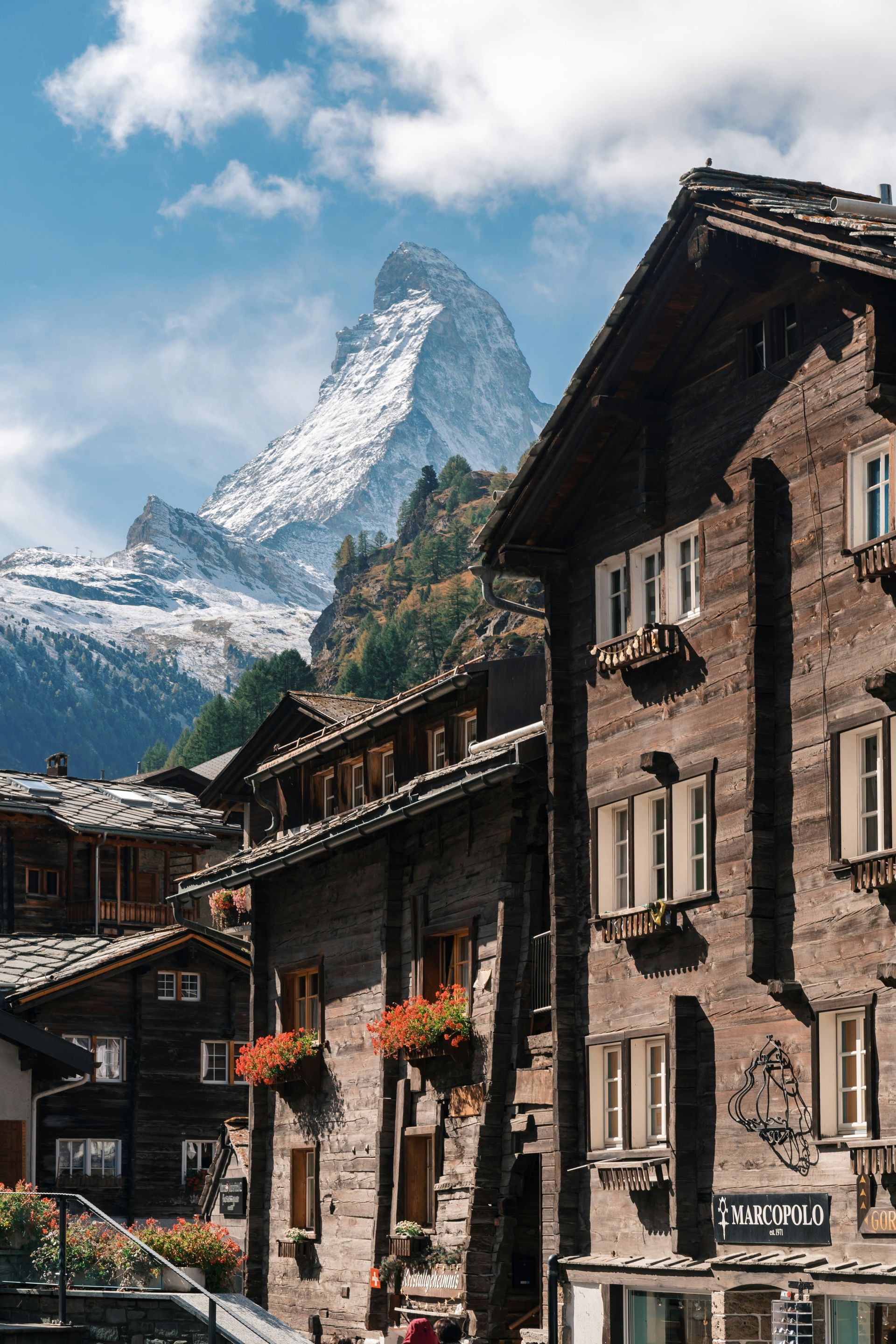 Wooden buildings in Zermatt, Switzerland, with the Matterhorn mountain in the background.