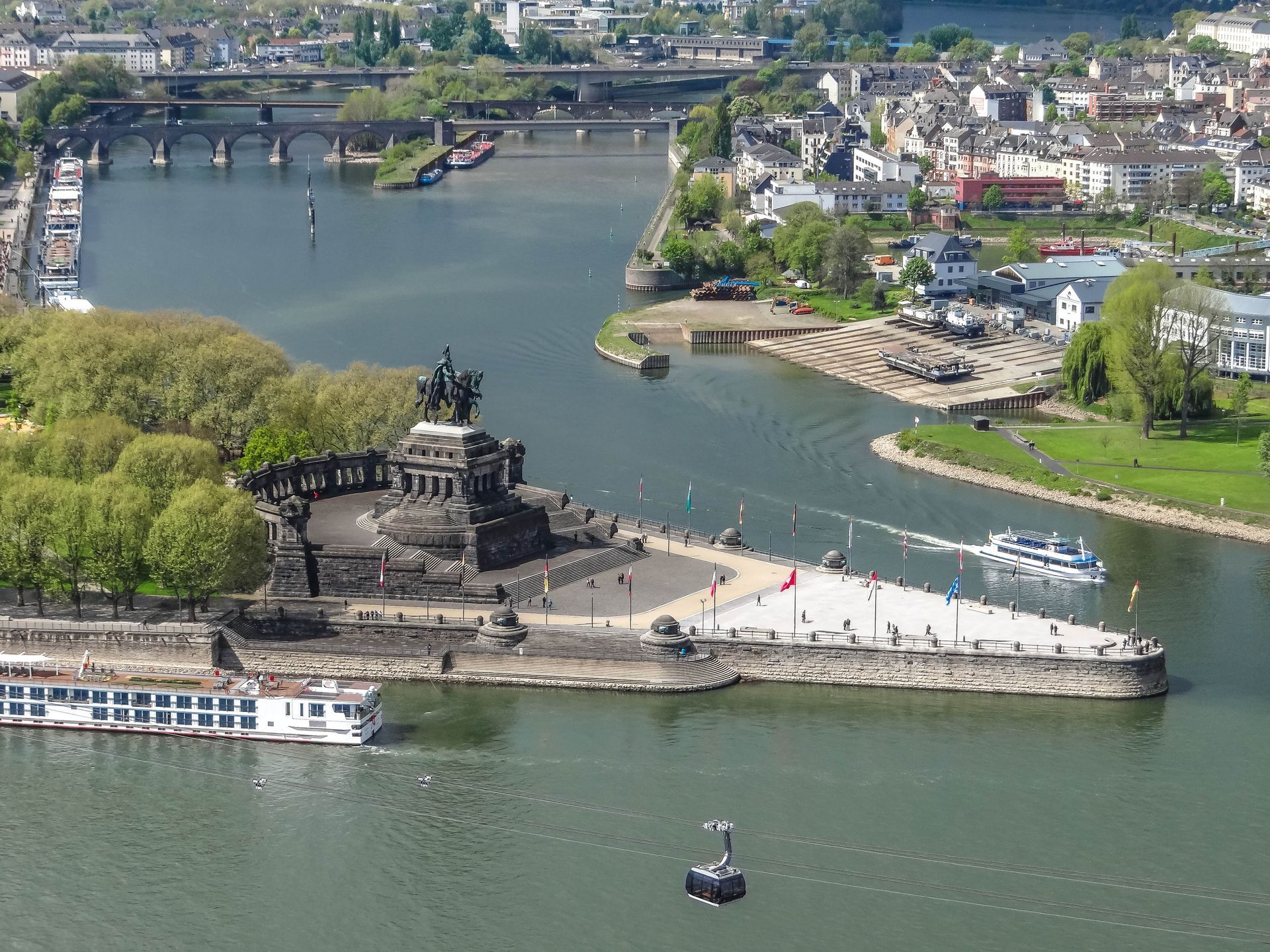 An aerial view of the Rhine Valley with a statue in the middle.