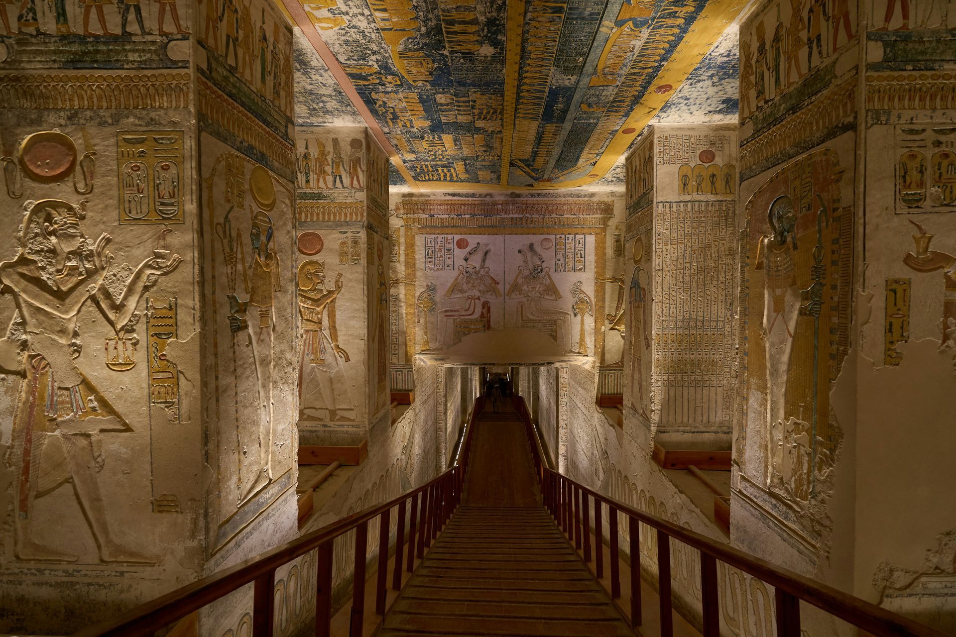 A very long hallway with stairs leading up to the ceiling in Luxor, Egypt.