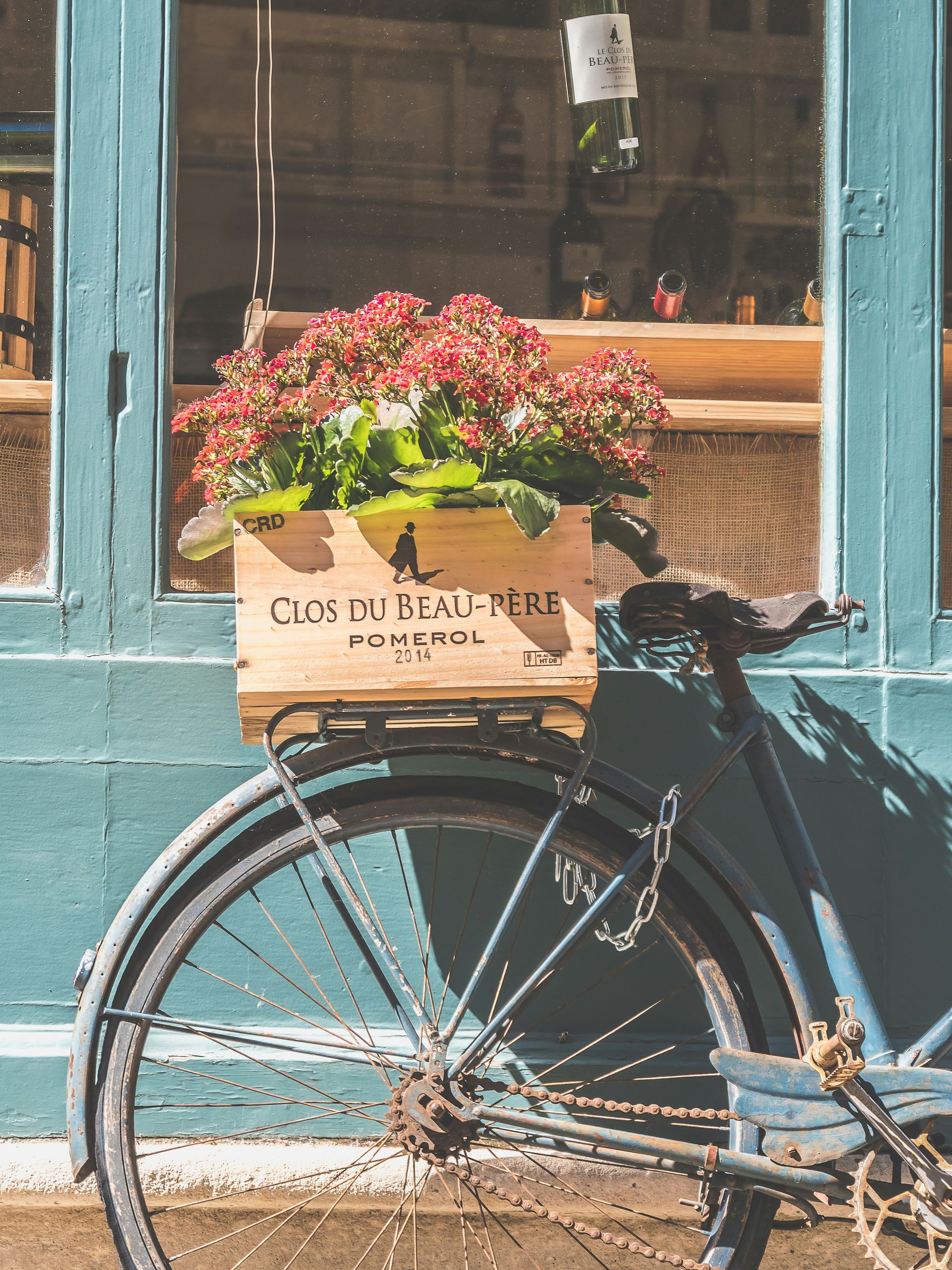 A bicycle with a wooden box on the back of it in Bordeaux, France.