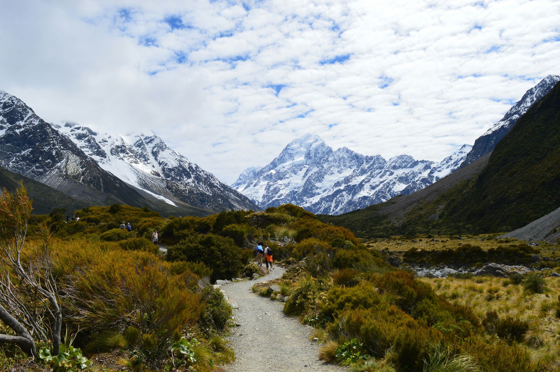 The Hooker Valley track path going through a valley with Mount Cook in the background in New Zealand.