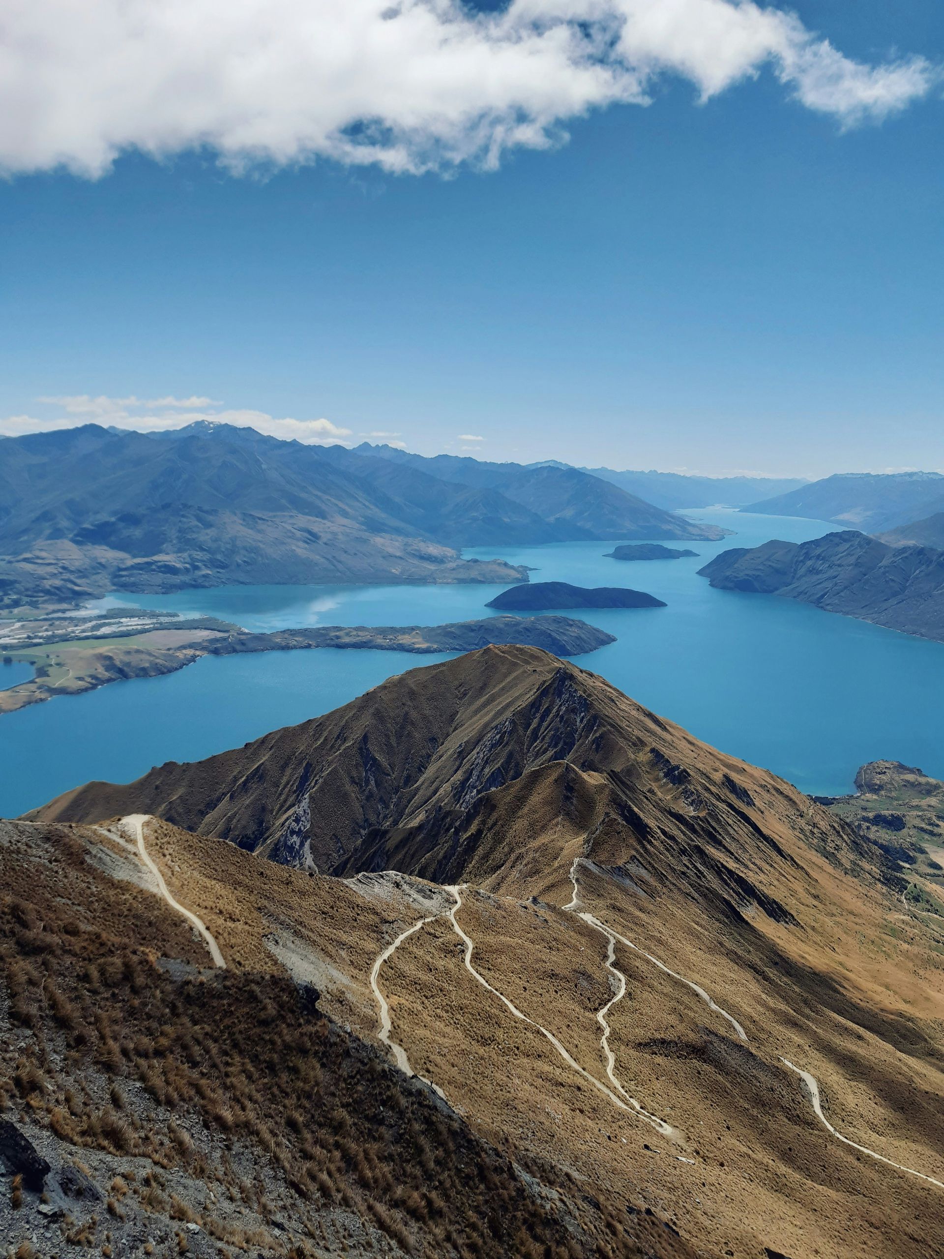 A view of a lake from the top of a mountain in Wānaka, New Zealand.