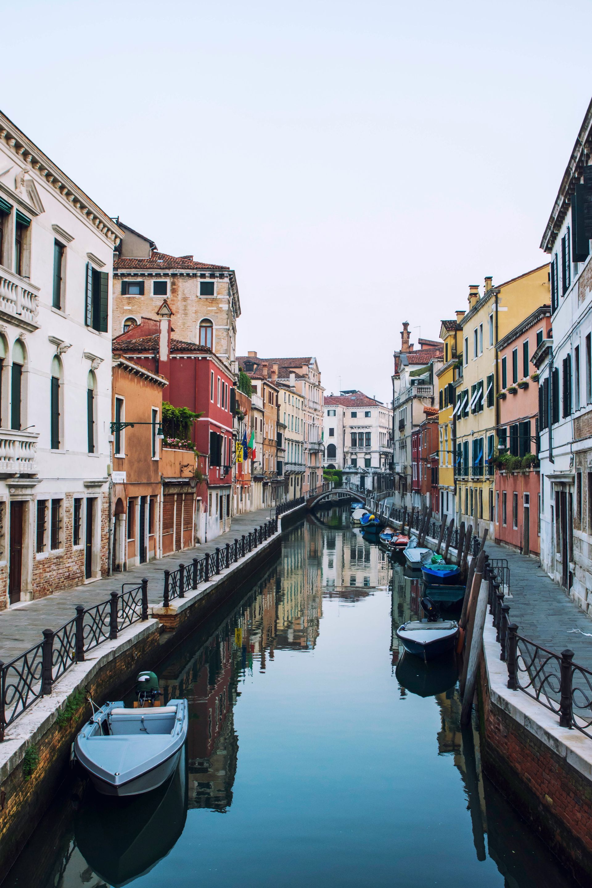 A canal in Venice with boats and buildings on both sides.