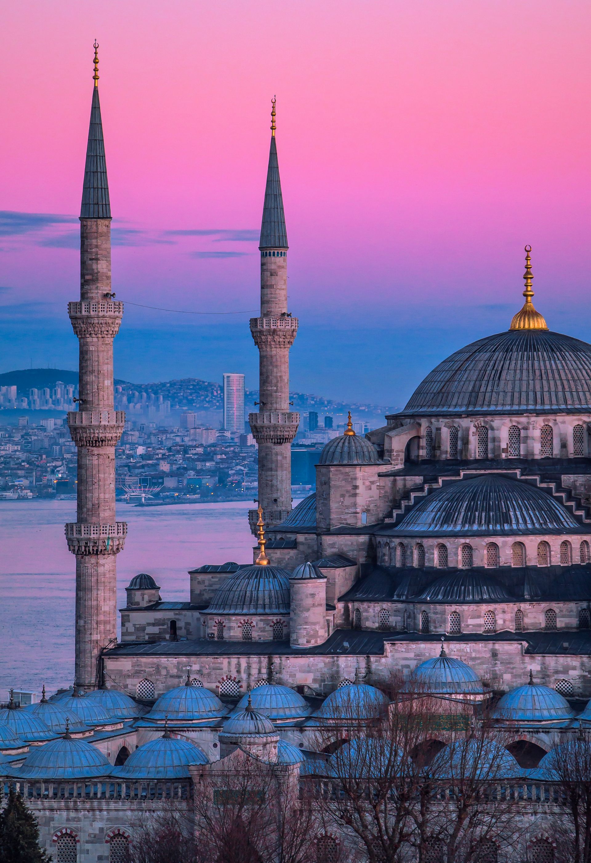 Mosque with minarets against a pink and blue sunset. Istanbul, Turkey.