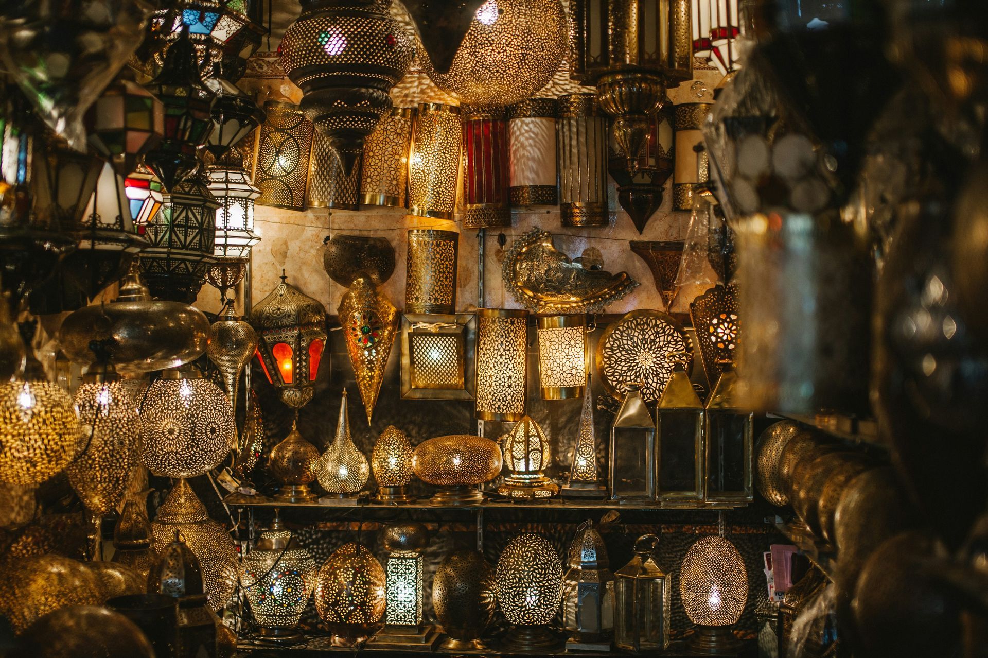 A bunch of lamps are sitting on a shelf in a store in Marrakesh, Morocco.