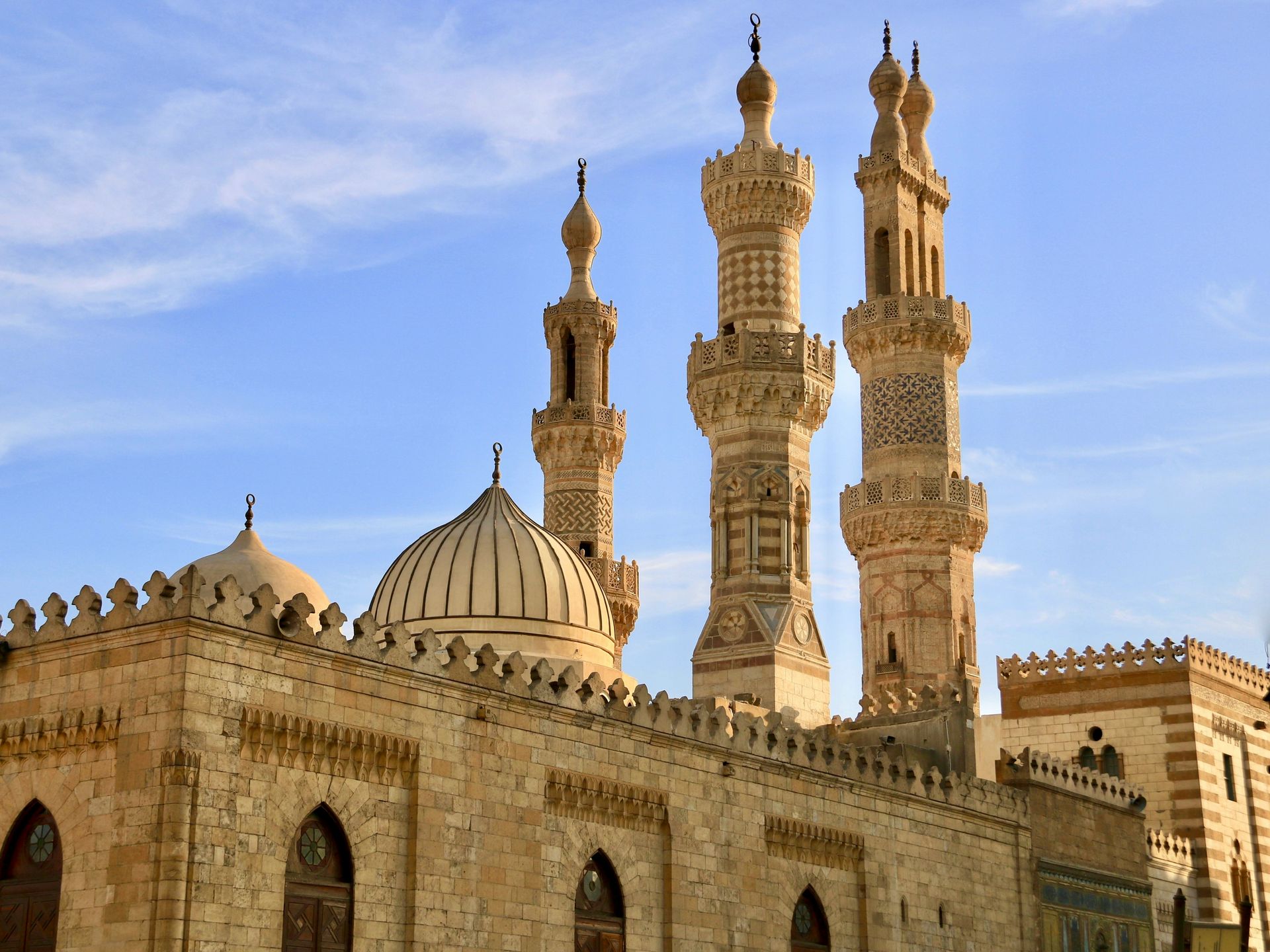 A mosque with a blue sky in the background in Cairo, Egypt.
