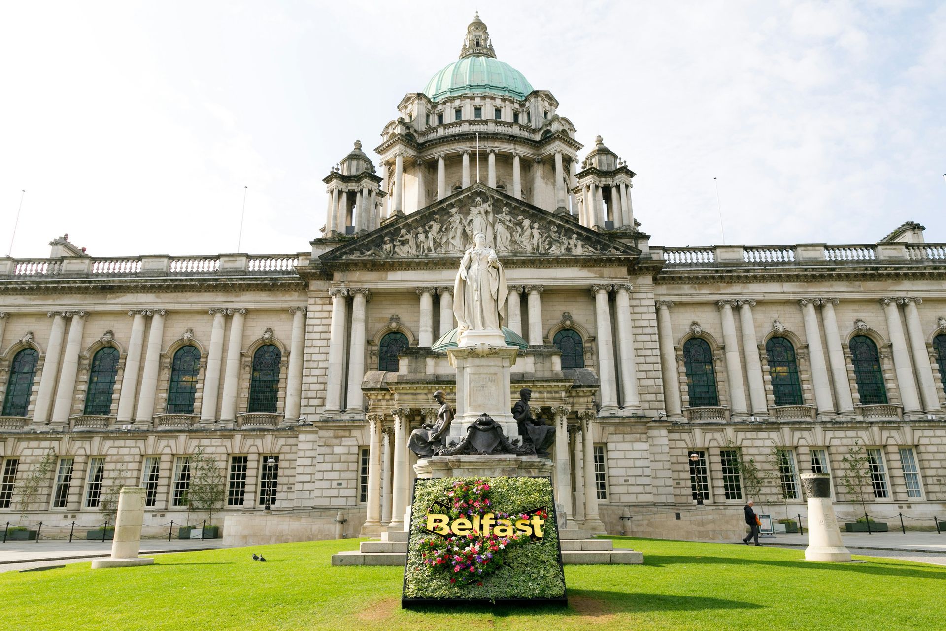 Belfast City Hall with a statue of Queen Victoria in front.