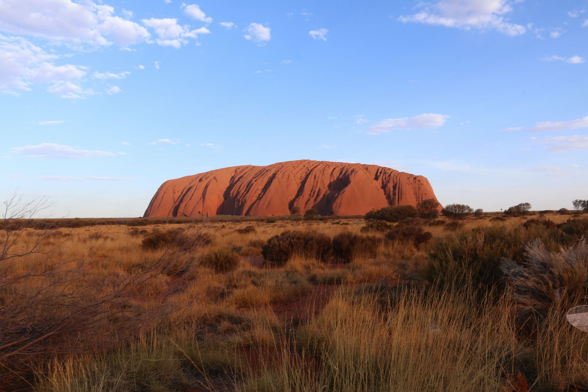 Uluru Rock in the middle of a desert in Australia.