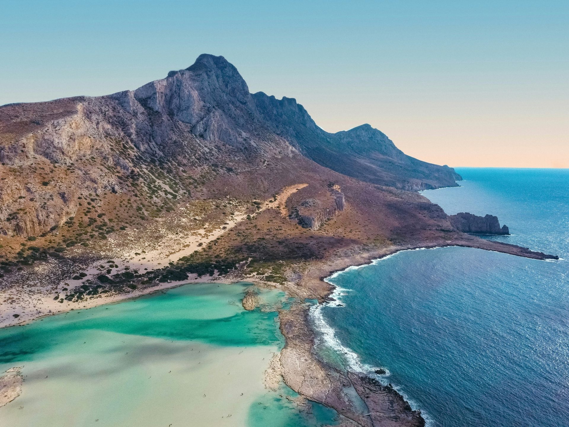 An aerial view of Balos Beach with mountains in the background in Crete, Greece.