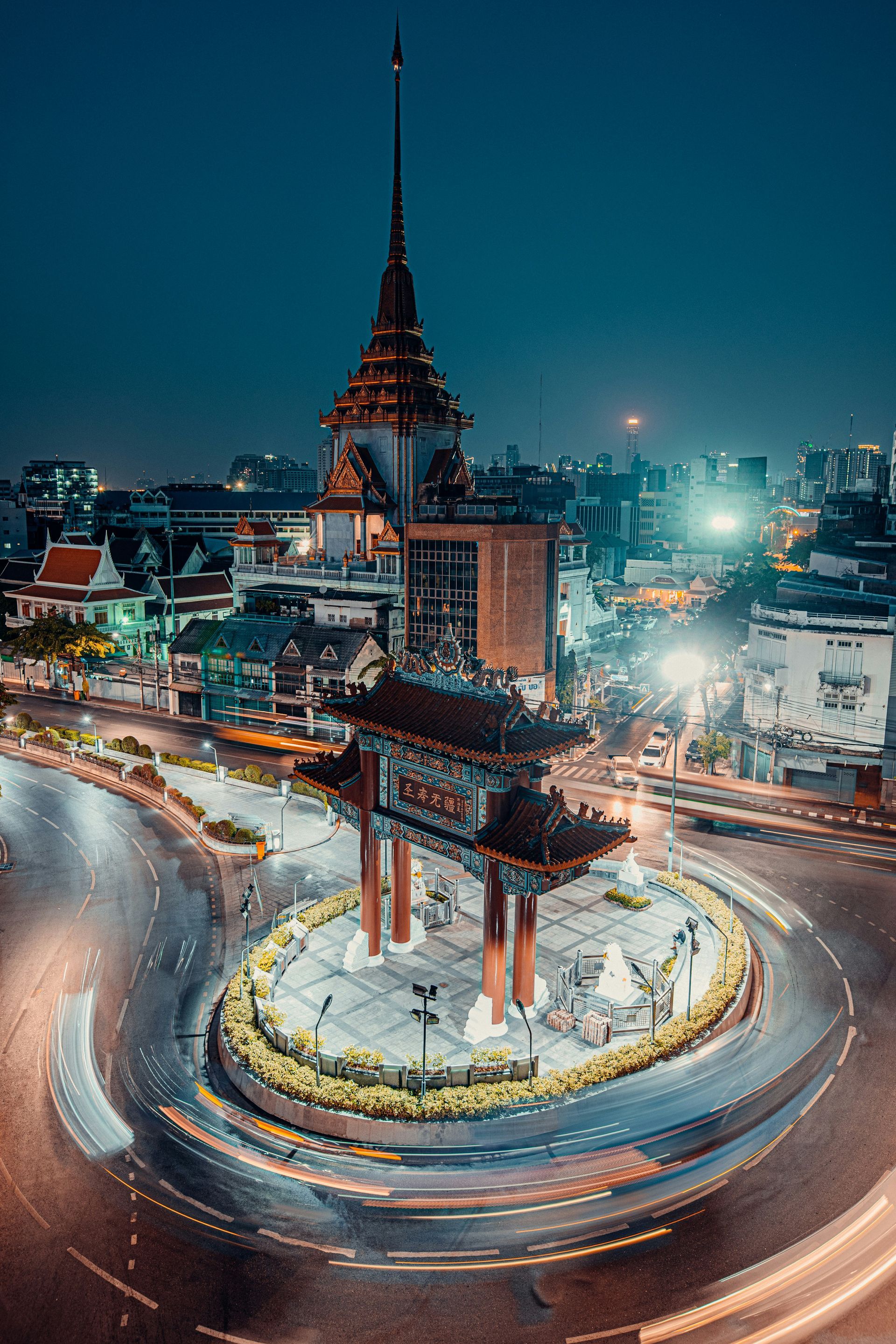 An aerial view of a highway in the middle of Bangkok, Thailand, at night.