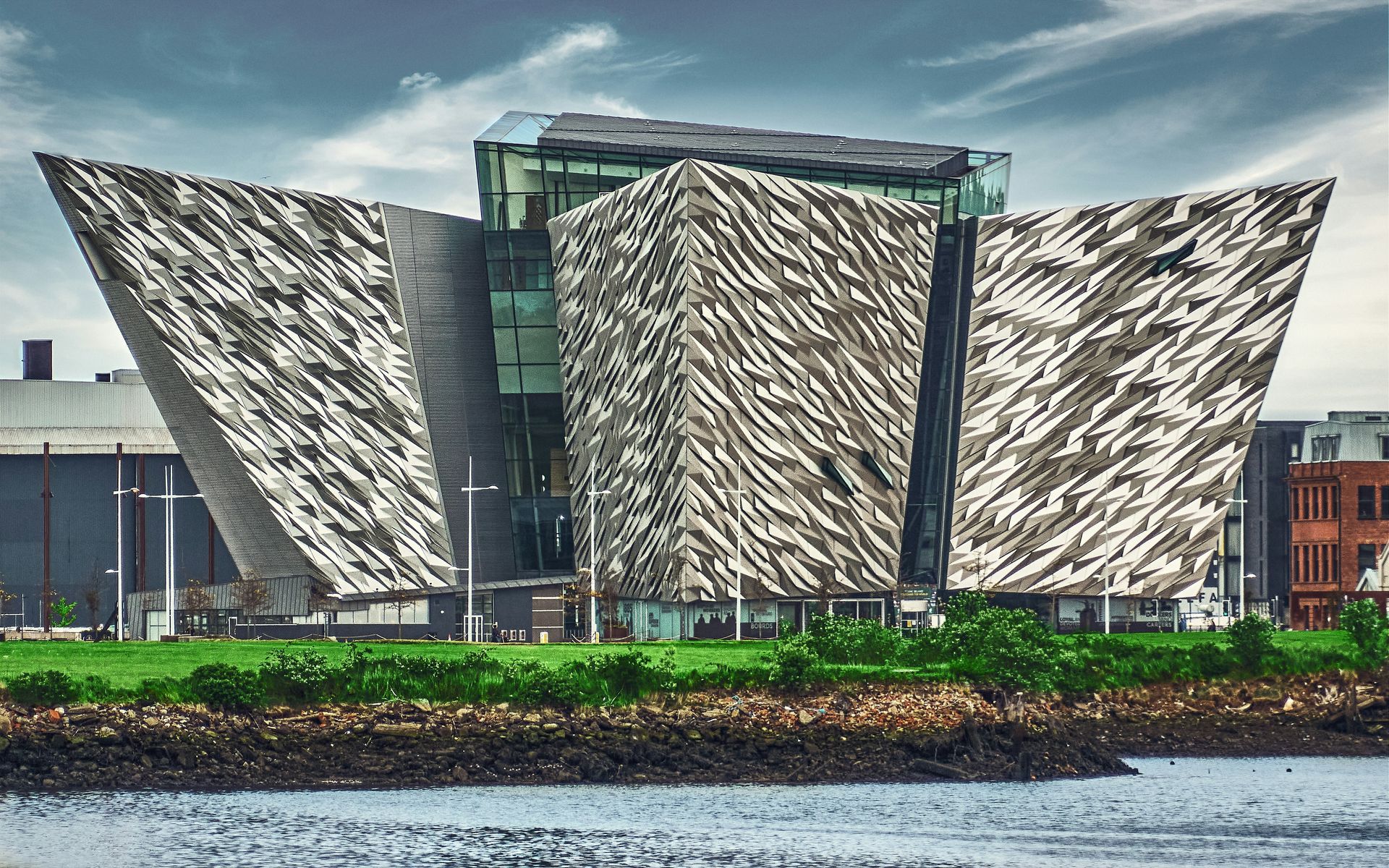 Titanic Belfast museum building, located on waterfront. Modern architecture, textured facade.